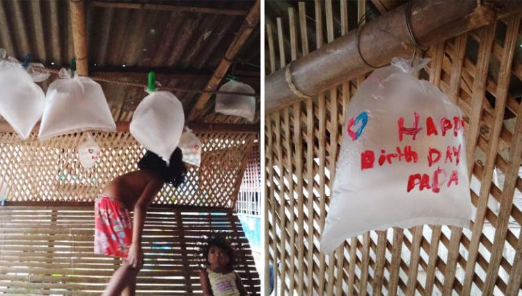 Humildes niños utilizan bolsas plásticas como globos para celebrar cumpleaños de su padre
